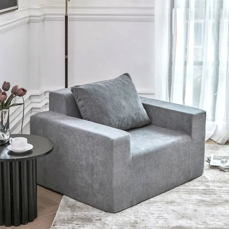 Poltroncina decorativa in schiuma grigia semplice con cuscino